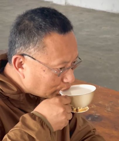monk drinking soymilk